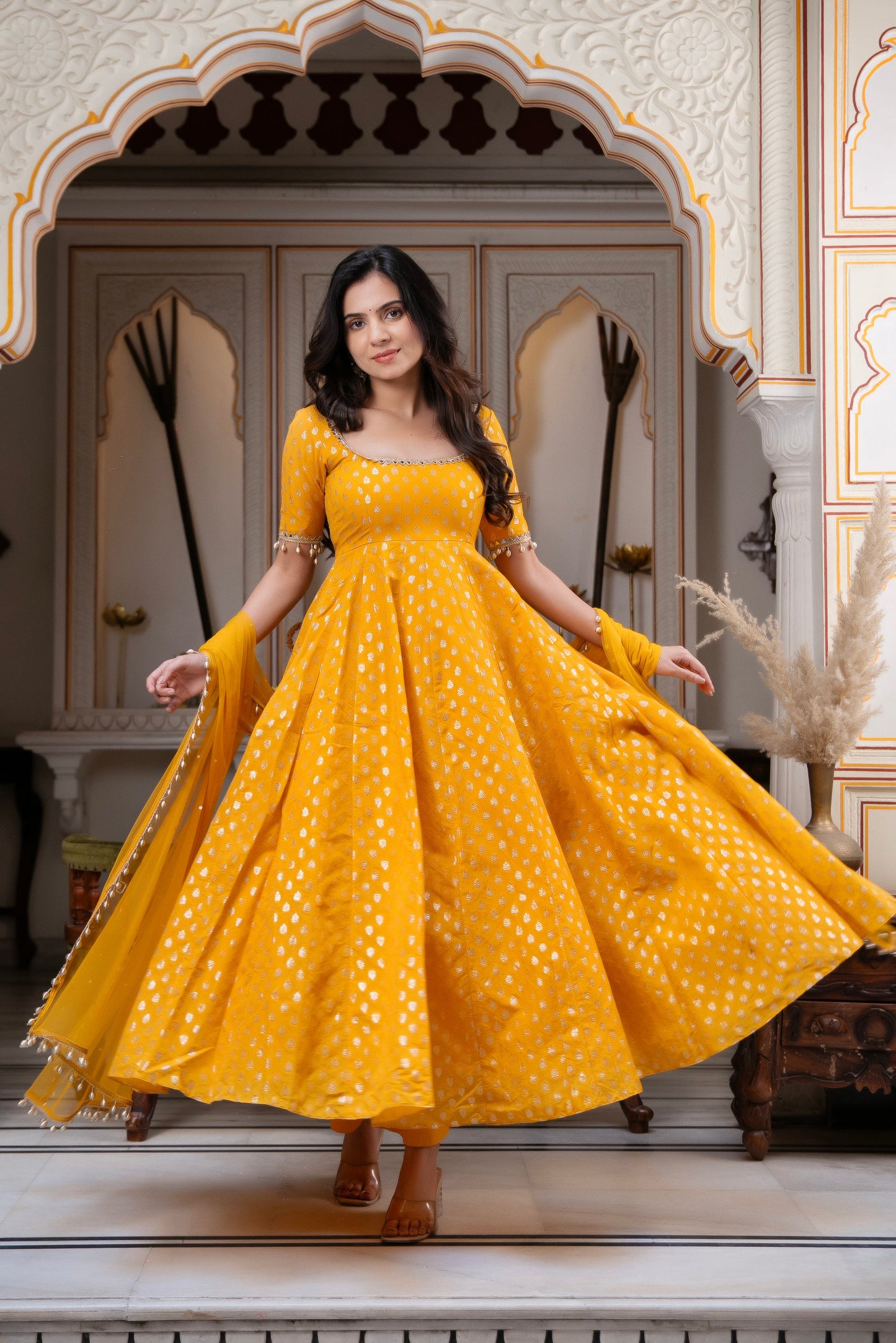 Charm with our exclusive 3-piece Yellow Anarkali Suit